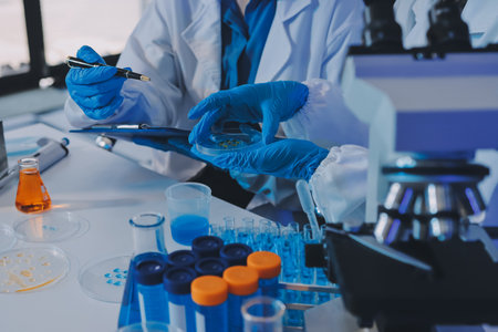 Collaboration, tablet or science with people in lab together for research or development. Innovation, tech and microscope with scientist team in clinical trial for planning or medical investigationの写真素材