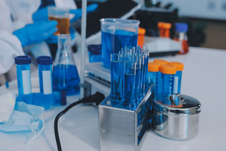 Collaboration, tablet or science with people in lab together for research or development. Innovation, tech and microscope with scientist team in clinical trial for planning or medical investigationの写真素材