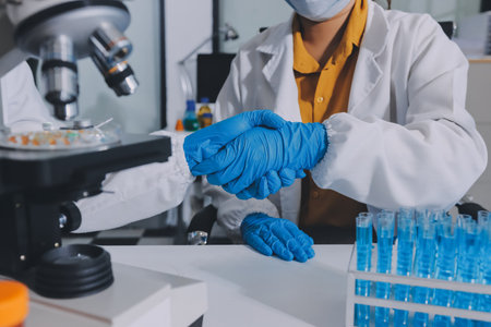 Collaboration, tablet or science with people in lab together for research or development....
