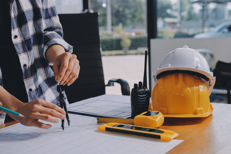Construction and structure concept of engineer working drawing on blueprint meeting for project...