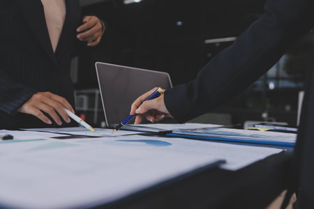 Team of business people working together in the meeting room office,
teamwork background charts and graphs banner, double exposure successful teamwork,business planning concept.の写真素材