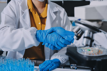 Collaboration, tablet or science with people in lab together for research or development....
