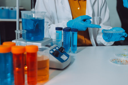 Collaboration, tablet or science with people in lab together for research or development....