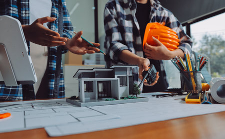 Construction and structure concept of engineer working drawing on blueprint meeting for project...