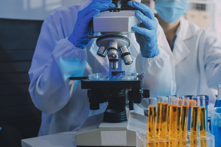 Collaboration, tablet or science with people in lab together for research or development....