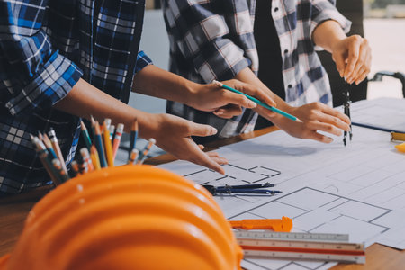 Construction and structure concept of engineer working drawing on blueprint meeting for project...