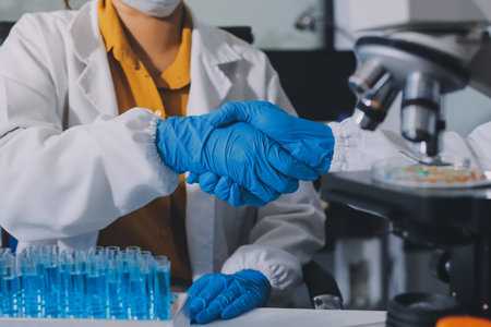 Collaboration, tablet or science with people in lab together for research or development....