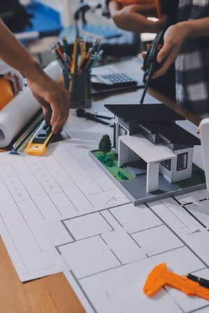 Construction and structure concept of engineer working drawing on blueprint meeting for project...