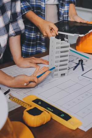Construction and structure concept of engineer working drawing on blueprint meeting for project...