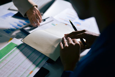 business people in meeting discussing plans togetherの写真素材