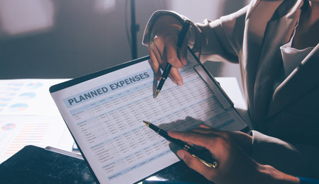 Business Team Analyzing Financial Data in Modern Officeの写真素材