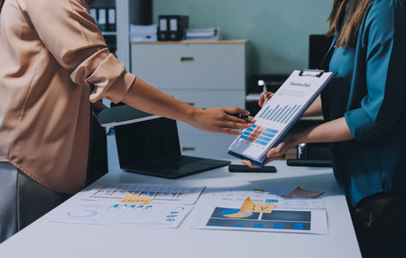 Professional Executive business team brainstorming on meeting to planning investment project working and strategy of business making conversation with partner and consultation of collaborationの写真素材