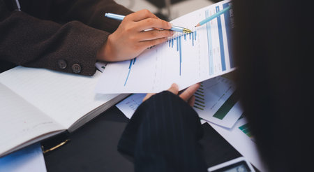 Success, audience with an applause and in a business meeting at work with a lens flare together. Achievement or celebration, motivation and businesspeople clapping hands for good news or supportの写真素材