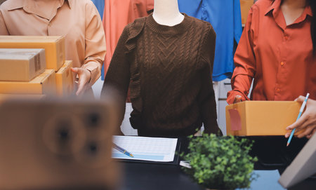 Portrait of Starting small businesses SME owners, two Asian woman check online orders Selling...