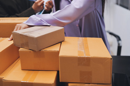 Portrait of Starting small businesses SME owners, two Asian woman check online orders Selling...