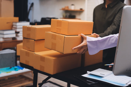 Portrait of Starting small businesses SME owners, two Asian woman check online orders Selling...