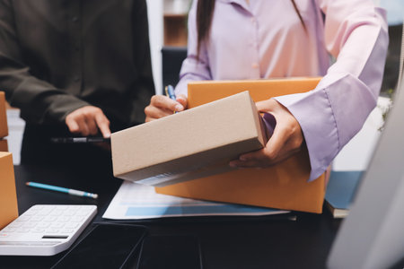 Portrait of Starting small businesses SME owners, two Asian woman check online orders Selling...