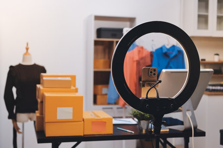 Portrait of Starting small businesses SME owners, two Asian woman check online orders Selling products working with boxs freelance work at home office, sme business online small medium enterpriseの写真素材