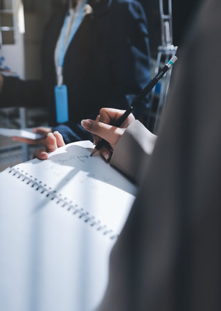 Close up high angle Asian businesswoman working with her coworker in meeting roomの写真素材