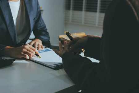 Lawyer explained to the client about the law that must be brought against the court case.