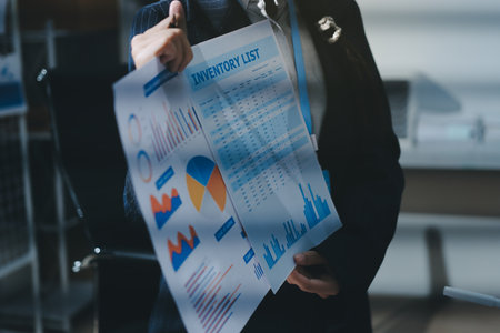 Close up high angle Asian businesswoman working with her coworker in meeting roomの写真素材