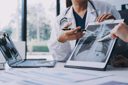 Medical team meeting analyzing results in hospital laboratory. Doctors and scientists in lab coats...