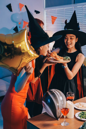 Friends enjoying a Halloween party making a toast