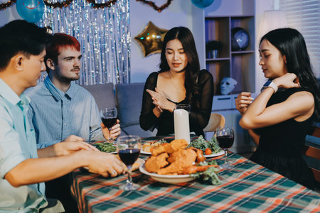 Diversity, dinner and group of people toast celebration together at party. Friends, happy and celebrate with food, wine and friendship for love, support and cheers champagne at business functionの写真素材