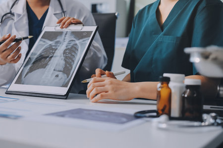 Medical team meeting analyzing test results in hospital laboratory. Doctors and scientists in lab...