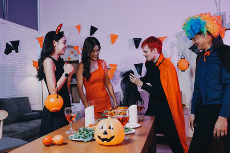 Joyful office Halloween party with coworkers in costumes, celebrating with drinks and laughter, fostering teamwork and festive spiritの写真素材
