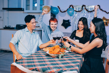 Diversity, dinner and group of people toast celebration together at party. Friends, happy and...