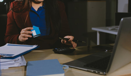 Customer signing a real estate contract in real estate agency.