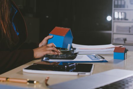 Customer signing a real estate contract in real estate agency.