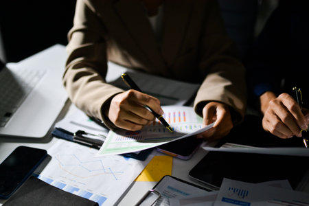 business people in meeting discussing plans togetherの写真素材