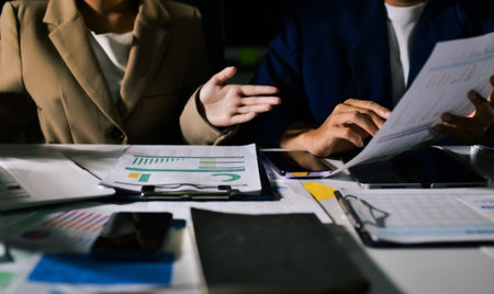 business people in meeting discussing plans togetherの写真素材