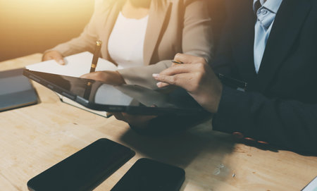 Accounting company provide finance and taxation planning for profitable cash flow, Auditor and accountant team working in office, analyze financial data and accounting record with calculator.Insightの写真素材