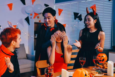 Joyful Halloween party with coworkers in costumes, celebrating with drinks and laughter, fostering...