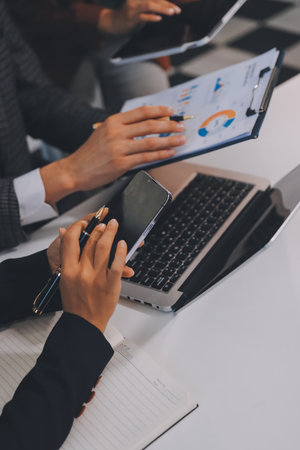 Accounting company provide finance and taxation planning for profitable cash flow, Auditor and accountant team working in office, analyze financial data and accounting record with calculator.の写真素材