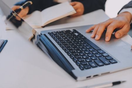 Accounting company provide finance and taxation planning for profitable cash flow, Auditor and accountant team working in office, analyze financial data and accounting record with calculator.Insightの写真素材