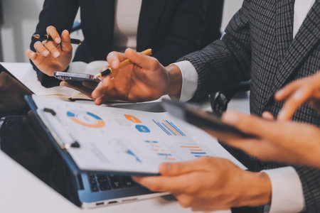 Accounting company provide finance and taxation planning for profitable cash flow, Auditor and accountant team working in office, analyze financial data and accounting record with calculator.Insightの写真素材