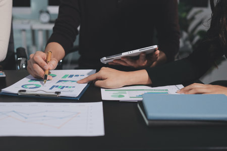 Accounting company provide finance and taxation planning for profitable cash flow, Auditor and accountant team working in office, analyze financial data and accounting record with calculator.Insightの写真素材