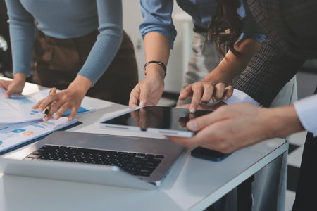 Accounting company provide finance and taxation planning for profitable cash flow, Auditor and accountant team working in office, analyze financial data and accounting record with calculator.Insightの写真素材