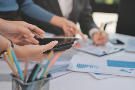 Accounting company provide finance and taxation planning for profitable cash flow, Auditor and accountant team working in office, analyze financial data and accounting record with calculator.Insightの写真素材