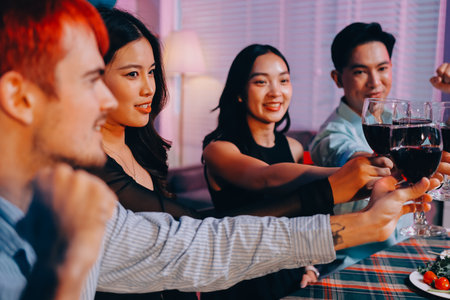 Diversity, dinner and group of people toast celebration together at party. Friends, happy and celebrate with food, wine and friendship for love, support and cheers champagne at business functionの写真素材