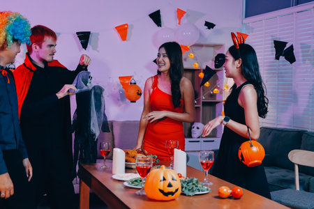 Joyful office Halloween party with coworkers in costumes, celebrating with drinks and laughter, fostering teamwork and festive spiritの写真素材