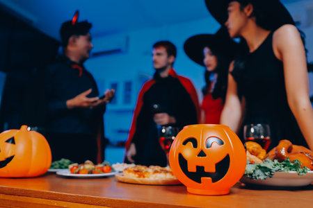 Joyful office Halloween party with coworkers in costumes, celebrating with drinks and laughter, fostering teamwork and festive spirit