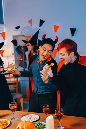 Joyful Halloween party with coworkers in costumes, celebrating with laughter, fostering teamwork and festive spiritの写真素材
