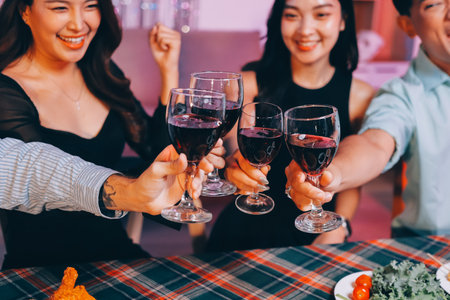 Diversity, dinner and group of people toast celebration together at party. Friends, happy and...