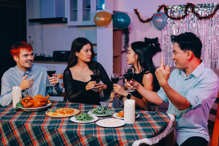 Diversity, dinner and group of people toast celebration together at party. Friends, happy and celebrate with food, wine and friendship for love, support and cheers champagne at business functionの写真素材