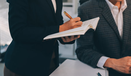 Accounting company provide finance and taxation planning for profitable cash flow, Auditor and accountant team working in office, analyze financial data and accounting record with calculator.Insightの写真素材